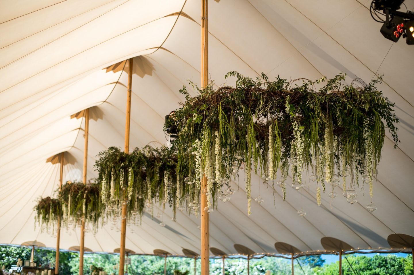 sperry sailcloth tent interior with hanging florals