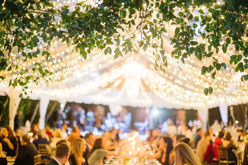 tented reception at night with twinkle lights