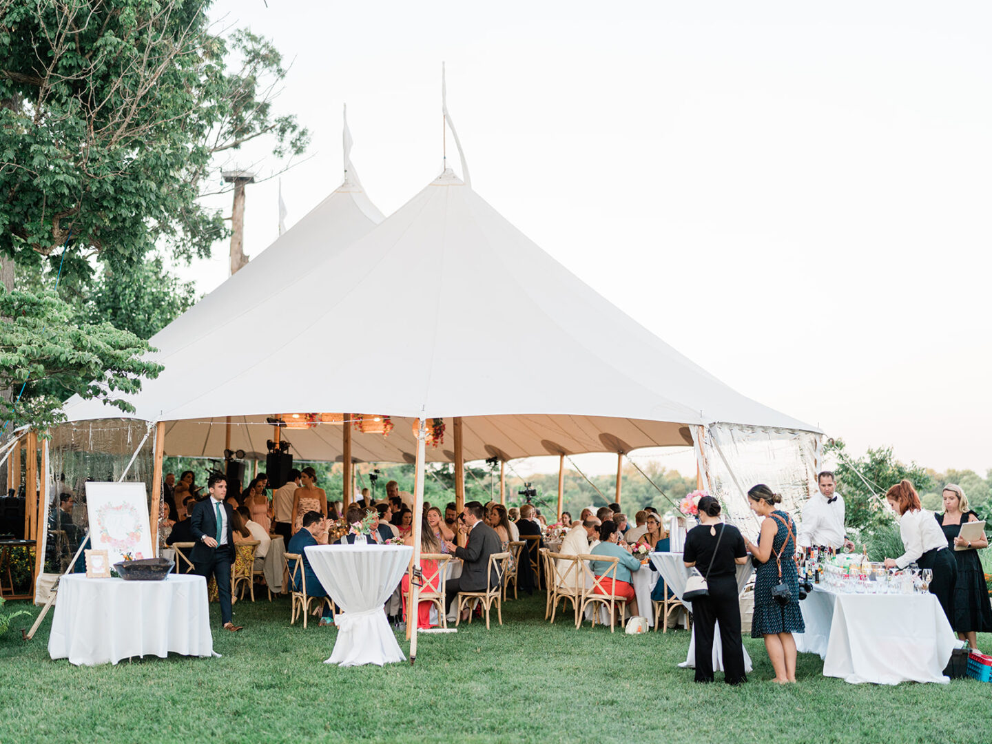 view of wedding reception under a Sperry sailcloth tent.