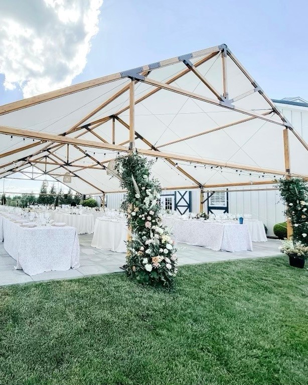 timbertrac tent with greenery and floral arrangements 