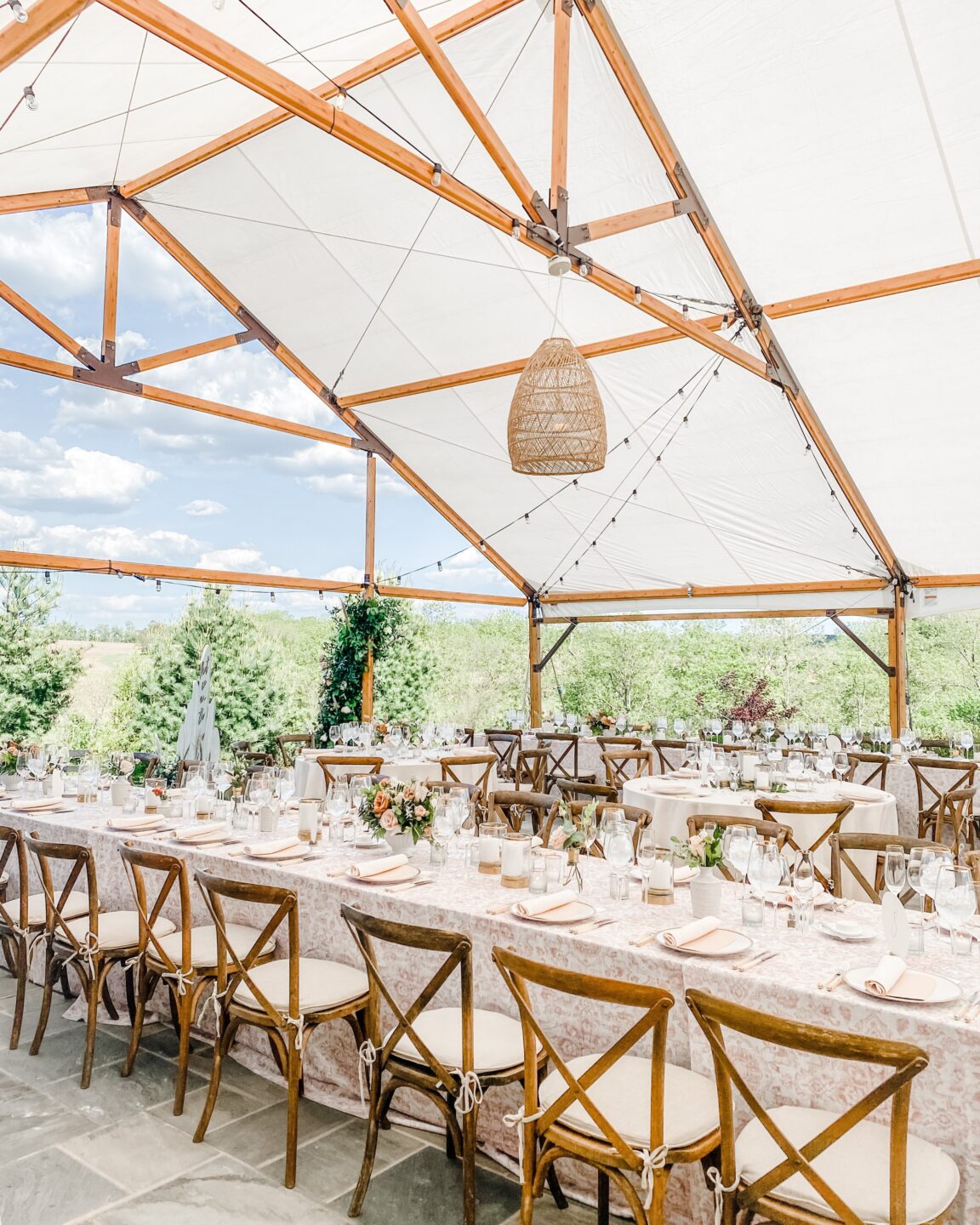 timbertrac tent with rattan lanterns supported from poles 