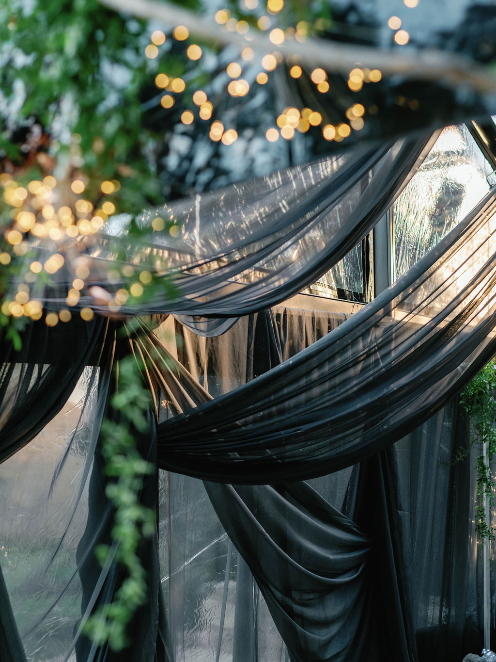 SEG tent with draping lights and linens 