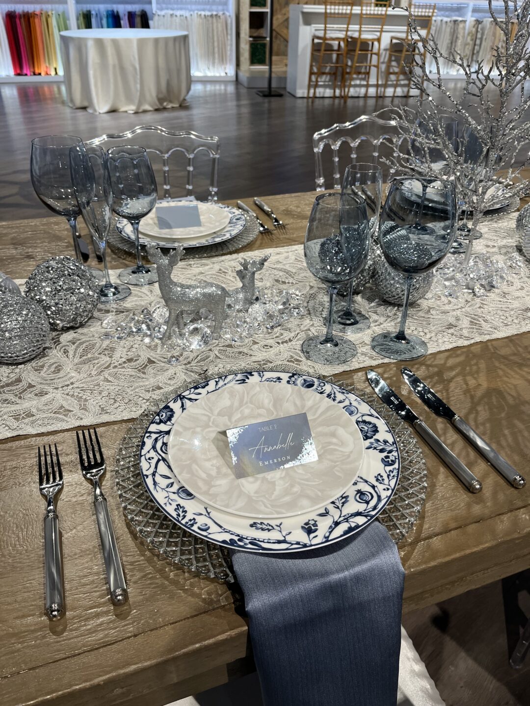 blue and silver holiday themed tablesetting wood table 