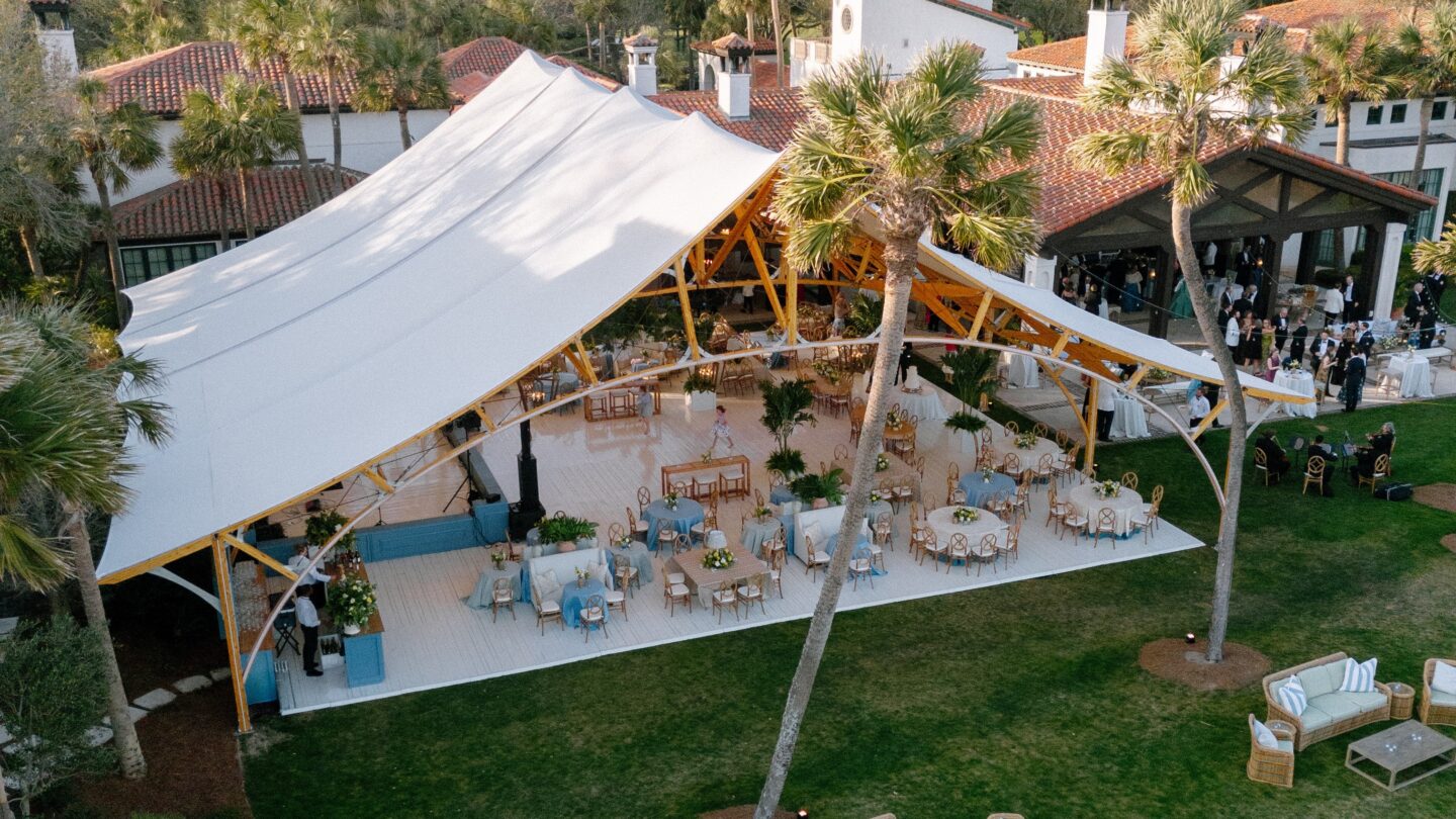 Exterior view of the Amelia Sperry Tent showcasing its elegant peaks and modern sailcloth design.