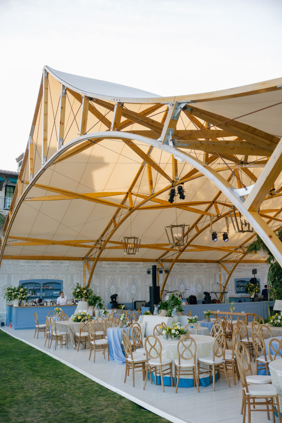 Angled Inside the Amelia Sperry Tent featuring styled tables, luxe linens, and seating for up to 140 guests.