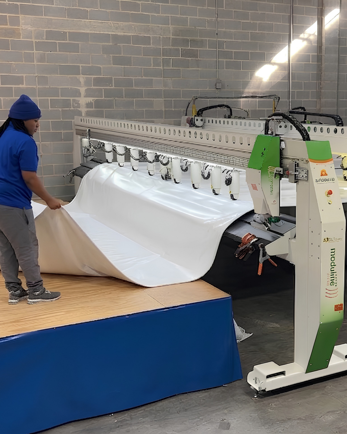 Select Event Group team member fabricating white vinyl on the Miller Weldmaster Moduline