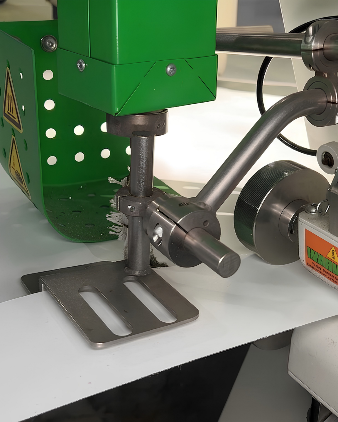 Close-up of the Miller Weldmaster Moduline fabricating white vinyl at Select Event Group